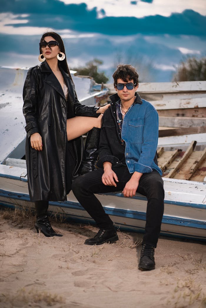 A man and woman sitting on a boat in the desert